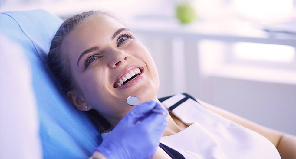 Smiling woman in dental chair