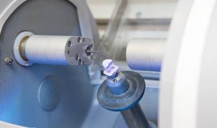 a dental crown being crafted using CEREC technology