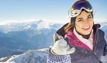 Woman at the top of a ski slope